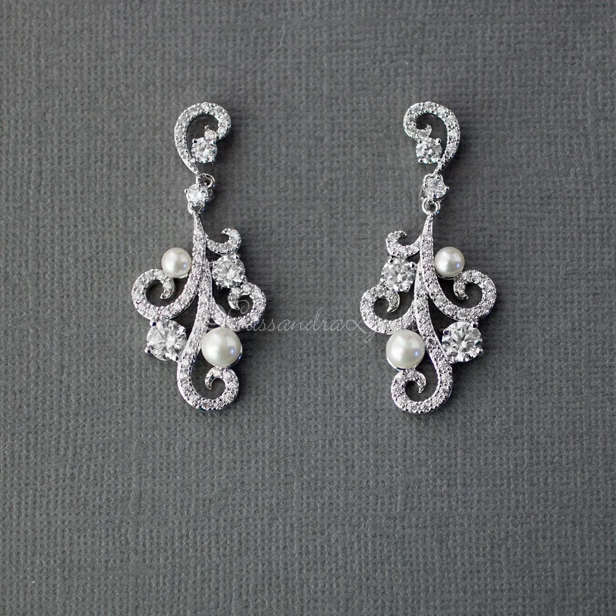 Sterling Silver Pearl CZ Earrings with a Swirl Design